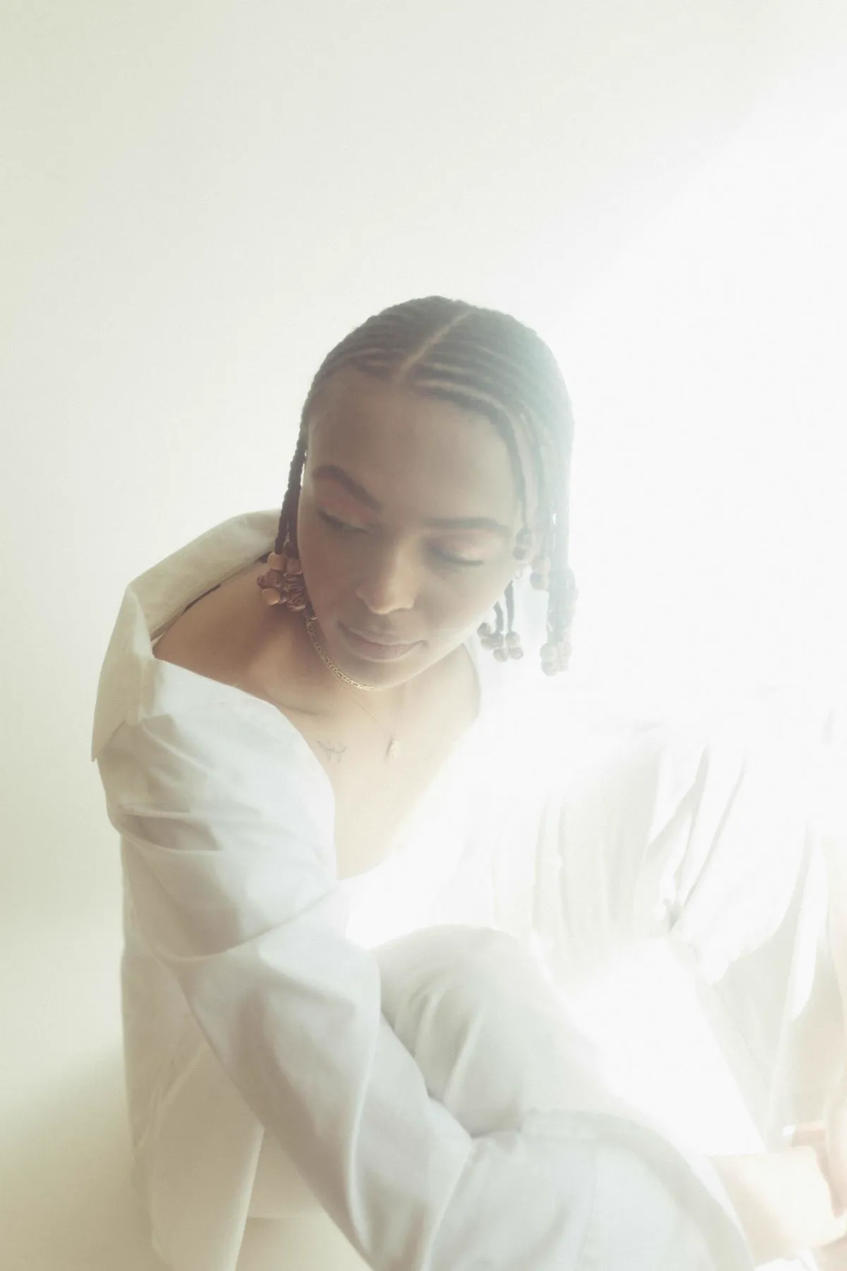 Cornrows and beads in soft natural light
